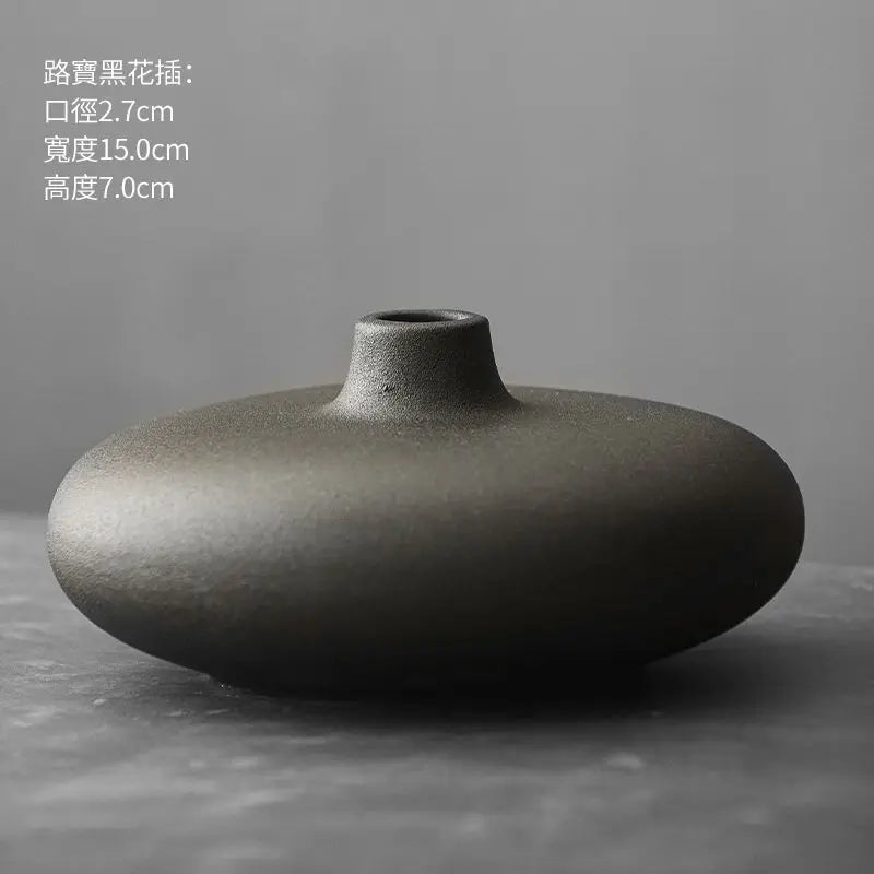 low disc ceramic vase, black, reference photo
