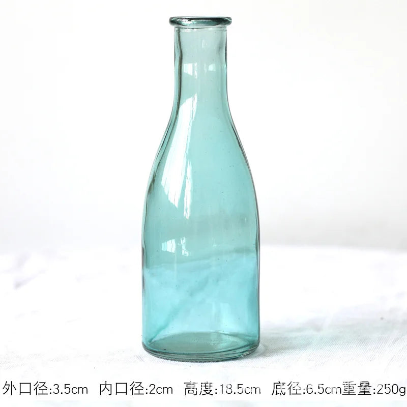 slender glass bottle bud vase, green, reference photo