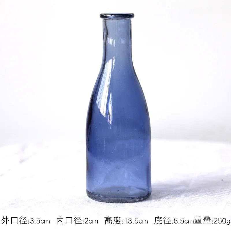 slender glass bottle bud vase, blue, reference photo